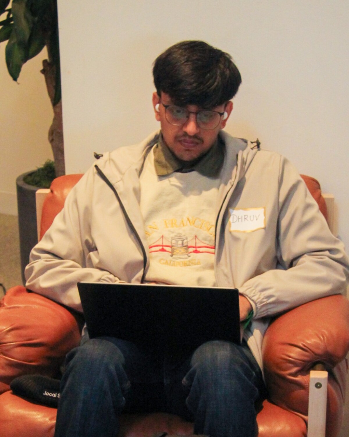 Dhruv Patel working on a laptop
